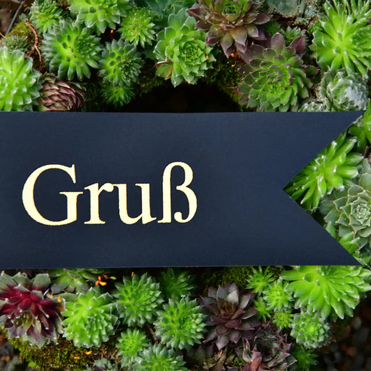 Schleife für den Trauerkranz in schwarz mit goldener Schrift